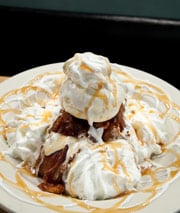 PB&J Delight. peanut butter and jelly sandwich dipped in pancake batter and deep fried with marshmallow caramel sauce and ice cream