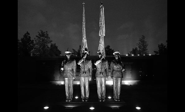 The photographer shot "Honor Guard" at the US Air Force Memorial in Arlington as part of her ongoing project to photograph all of the area's memorials, statues, and monuments.  "I liked the nighttime lighting and thought it would be pretty cool in black a