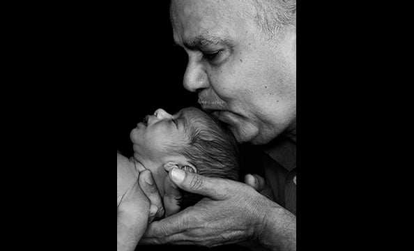 "Wisdom and the Future" depicts Achal Verma and his newborn grandson, Aman.  The photographer was hired by the Verma family to photograph a traditional Indian ceremony celebrating the child's birth.  "I took one look at Achal and envisioned this photograp