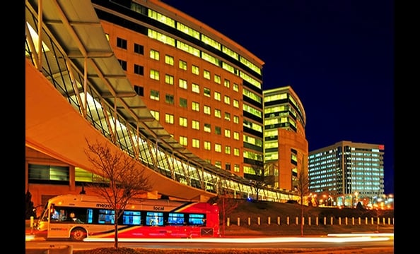 "City Life". This glowing IRS building in New Carrollton on a January night,  received 33 percent of the reader vote.  The bold lines and bright windows grab the eye, but it's the Metrobus that brings the message home.
        "I couldn't believe it when