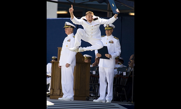 'Grad Gets Air".  The winner of our first-ever photo contest, Ventura's photograph shows his eldest son, Christopher, moments after receiving his diploma from the Naval Academy.  Ventura says his son tipped him off that he'd celebrate with a leaping heel 