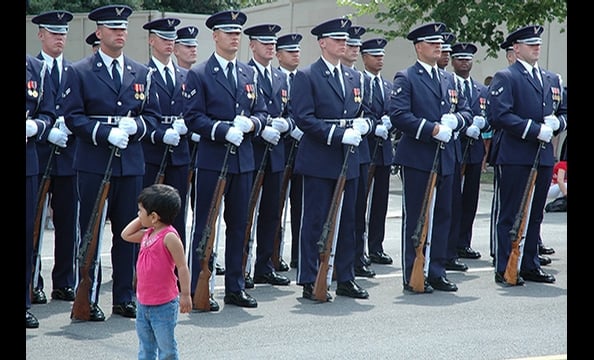 "Guards of Honor" was taken at a 2007 Independence Day parade.  Two-and-a-half year old Mythili, Menon's daughter, wandered into the frame while he was shooting a photo of the honor guard.  "Everyone looked so serious," Menon says. "But there was my daugh