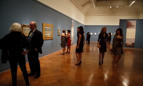 Guests taking in the art exhibits upstairs.