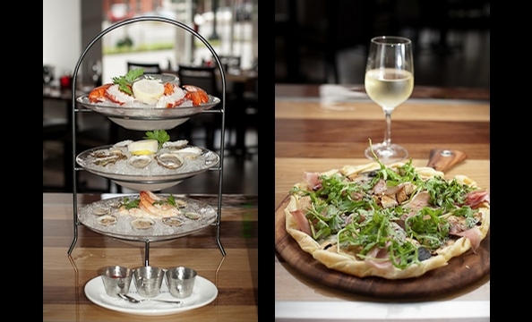 The PassionFood folks open a burger joint and upscale American dining room under one roof. A flatbread holds Tennessee prosciutto, figs, and blue cheese.