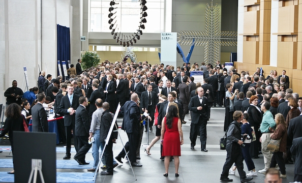 The crowd waited in long lines to pick up their tickets to the event.