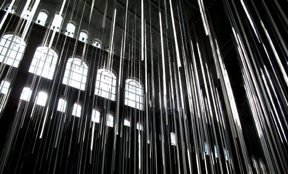 This photo was taken at the National Building Museum before a party. The photographer thought the streamers created a nice contrast next to the light from the windows.