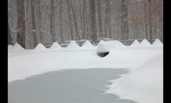 A snapshot from the blizzard in December. We think that's a diving board under that snow drift.