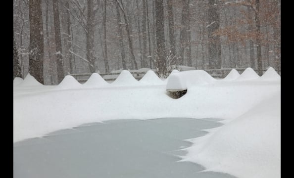 A snapshot from the blizzard in December. We think that's a diving board under that snow drift. 