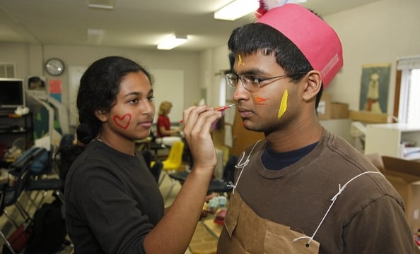 Students prepare for a reenactment as part of a history class.