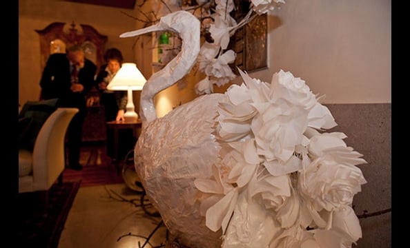 This paper-mâché creation keeps theme with a rose-covered tail.  