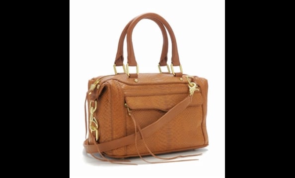 Sublimely simple and available in a bevy of sizes and fabrics, we hereby declare this structured tote 2010's version of the classic quilted Chanel bag.