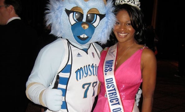 Mrs. District of Columbia Deanna McCray James enjoys the silent auction and cocktail hour at SneakerBall with Washington Mystics mascot, Lucky.