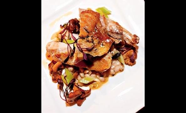 Pheasant breast is paired with a rustic, wintry stew of coco beans and chanterelle mushrooms at Eola in DC's Dupont Circle.