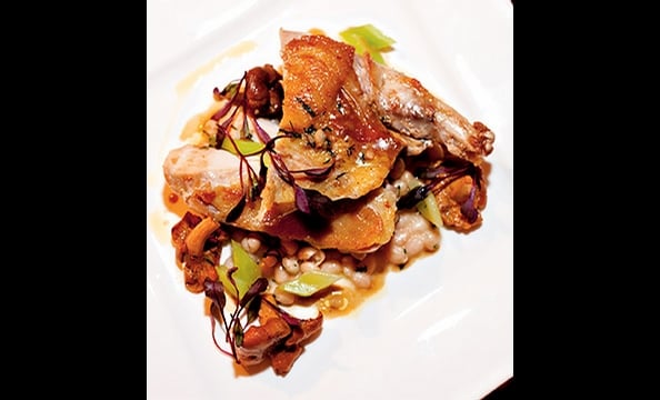 Pheasant breast is paired with a rustic, wintry stew of coco beans and chanterelle mushrooms at Eola in DC's Dupont Circle. 