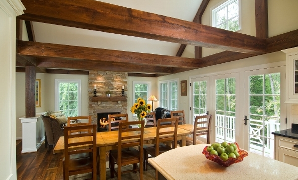 A living space with a gas fireplace is opposite the kitchen, and was also part of the addition. This is one of two fireplaces in the home. 