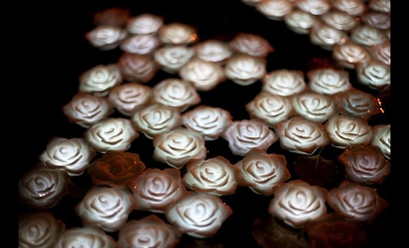 The rose theme motif continued outside the Embassy with these ethereal candles floating in the front yard pond.
