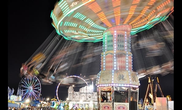 In a city focused on forging ahead, civil engineer Paul Koptya took a more circuitous approach to August's transportation-themed photo contest. His electric photo of the swing ride at this summer's Montgomery County Fair—shot with long exposure on a Niko