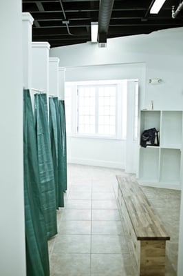 His and her locker rooms feature a changing space, lockers, and shower stalls.