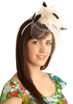 For another fascinator option, try this feathered headpiece.  