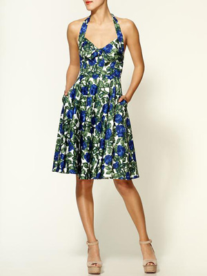 A halter top, knee-length skirt, and fun floral print make this dress too sweet to pass up.   