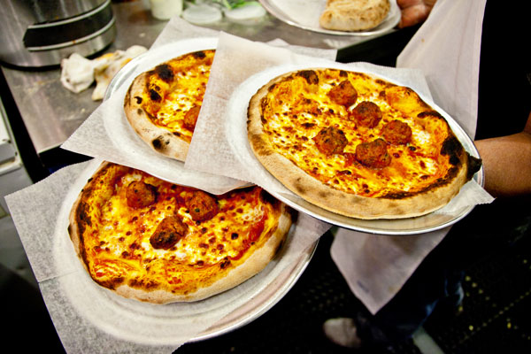 At Comet Ping Pong, these nicely blistered wood-fired pizzas come topped with meatballs.