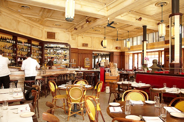 The airy main dining room is flanked by a 30-seat zinc bar, picked by Chateau Marmont designer Shawn Hausman from a market in Paris. Photograph by Jeff Elkins. le diplomate