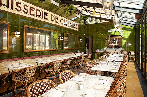 The garden room off the main dining area opens onto a 60-seat patio and allows plenty of sunshine through a glass roof. Photograph by Jeff Elkins. le diplomate