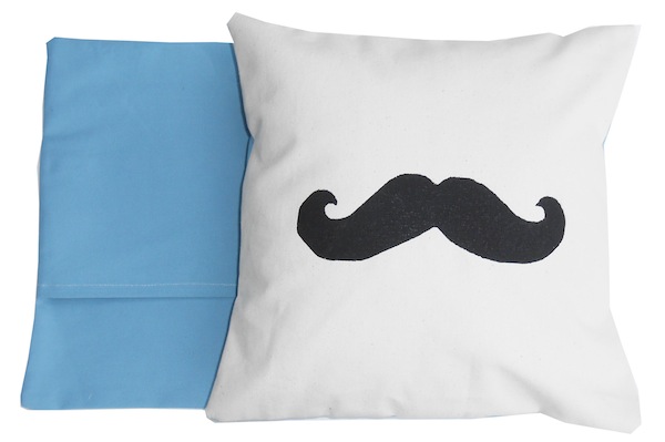 Add a whimsical touch to your home with this silk-screened mustache pillow, $36 at <a href="http://www.lilfishy.com/homedecor.htm">Lil Fishy</a>.