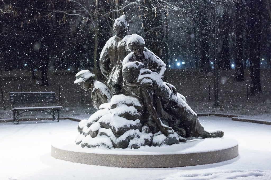 Snow falls on the Vietnam Women's Memorial. Photograph by Harrison Jones.