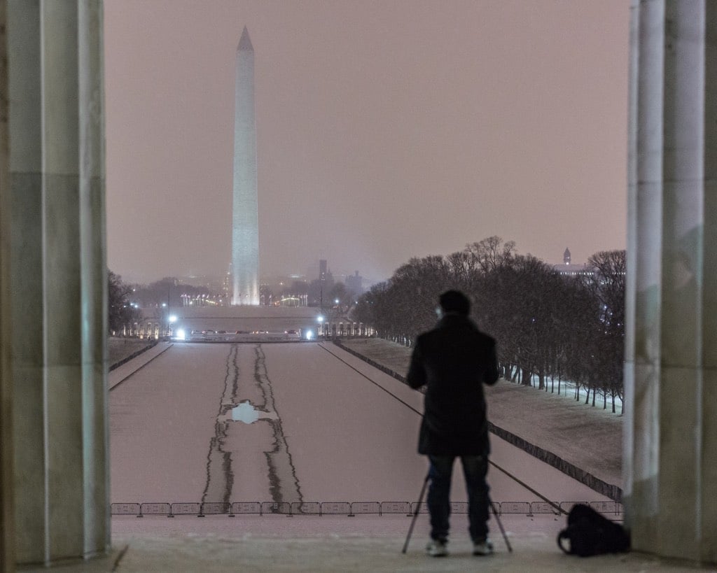 Snow falls on the National Mall. Photograph by Harrison Jones.