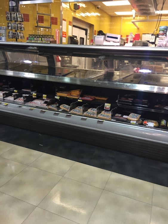 The empty deli counter at a DC Harris Teeter. Photograph by Callan Mathis. 