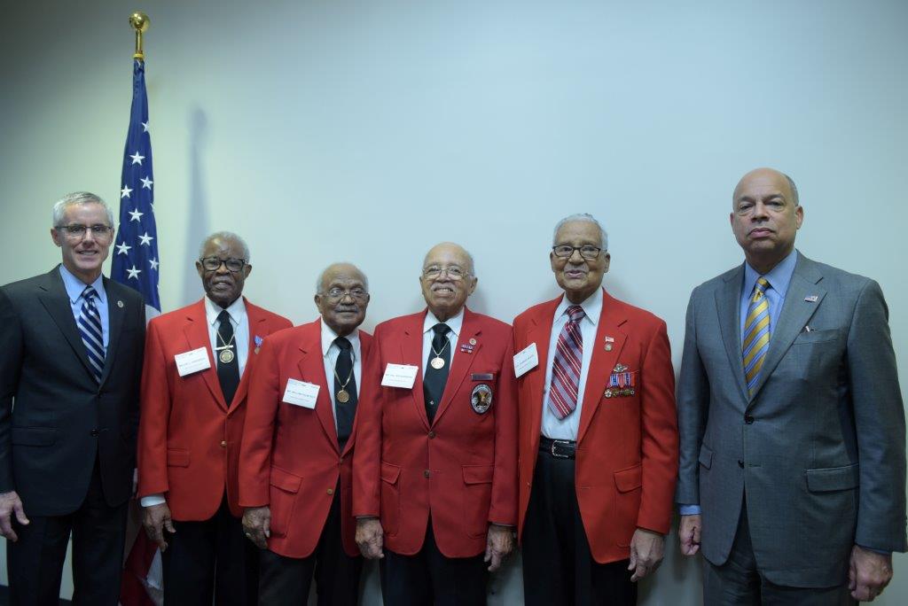 Tuskegee Airmen, in red, from left to right: Major L. Anderson, William T. Fauntroy Jr., Walter K. Robinson, Colonel Charles E. McGee