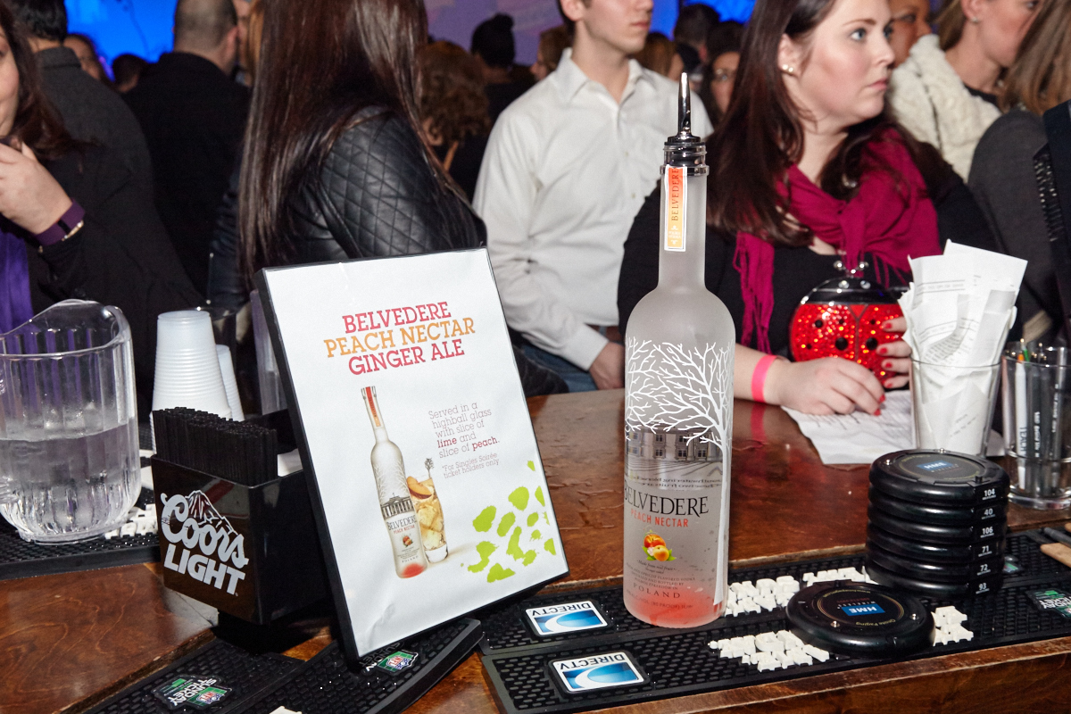 Attendees line up at the bar for a specialty cocktail provided by Belvedere. 