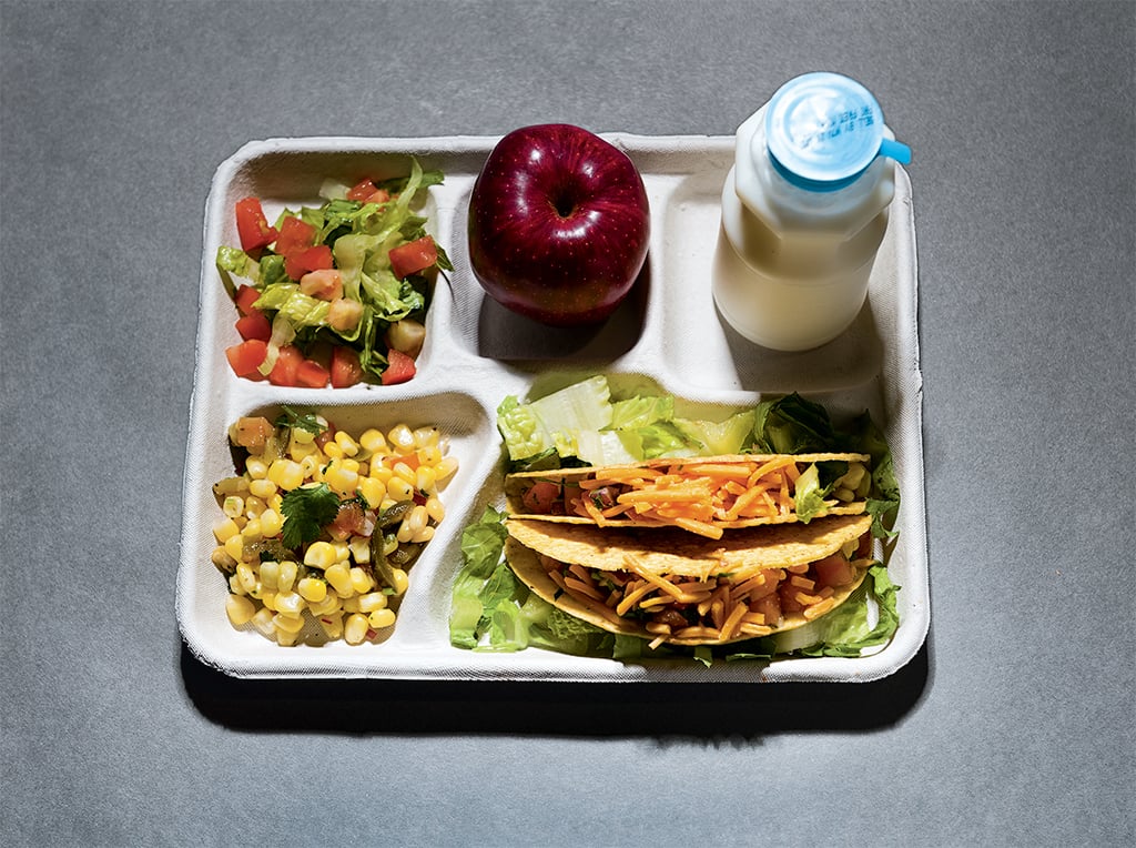 DC cafeteria meals: Turkey tacos with corn salsa and green salad, apple, and milk. Photograph by Andrew Propp.