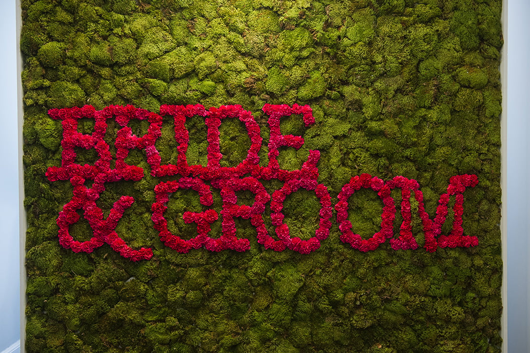 Edge Floral Event Designs and Revolution Events crafted this beautiful Bride & Groom floral wall. 