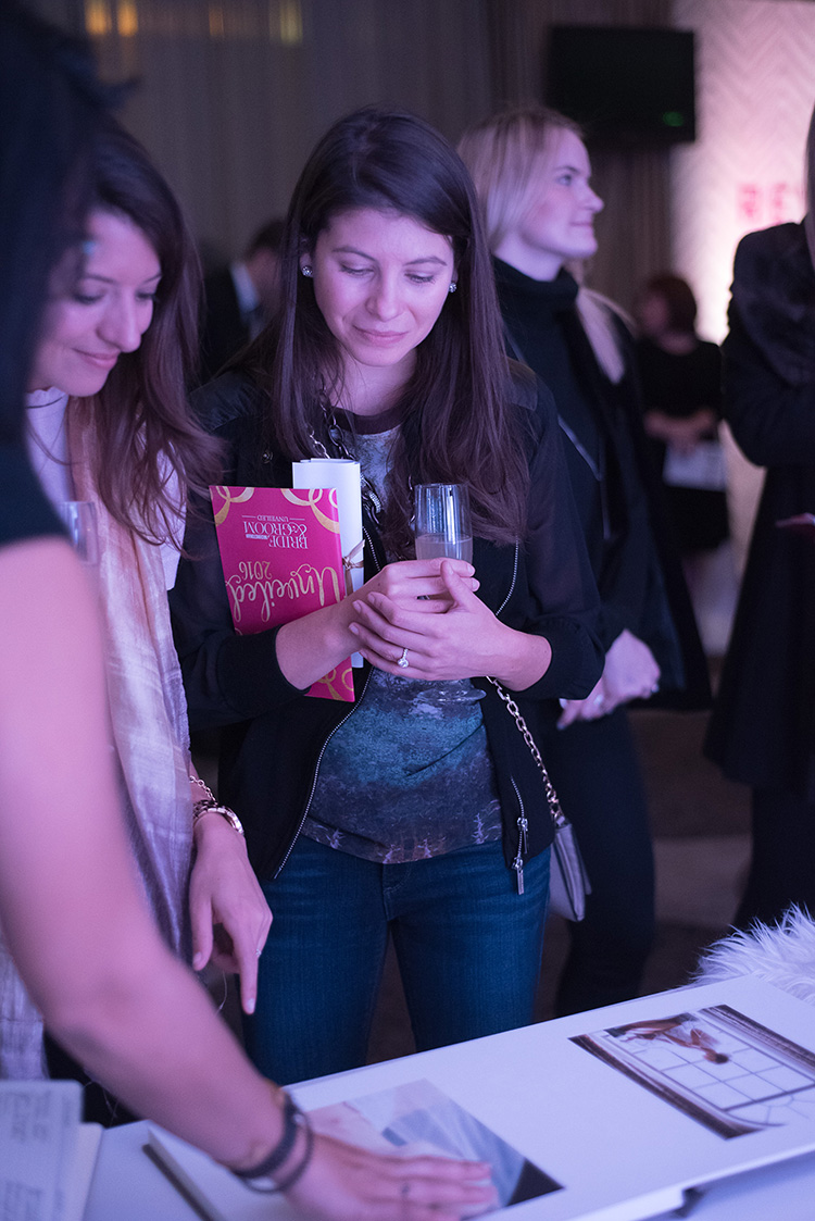 Bonnie Sen showed off some of her photographs to an eager onlooker at the event. 