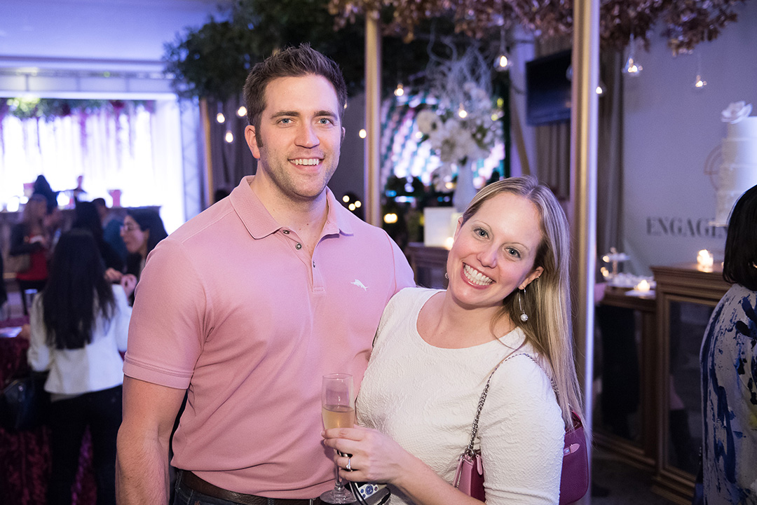 A newly engaged couple enjoys the Unveiled showcase. 