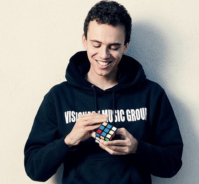 marchthingstodo_logic - Washingtonian Logic has a thing for Rubik’s Cubes—he owns dozens and likes to solve them while he raps. Photograph by Emily Shur.