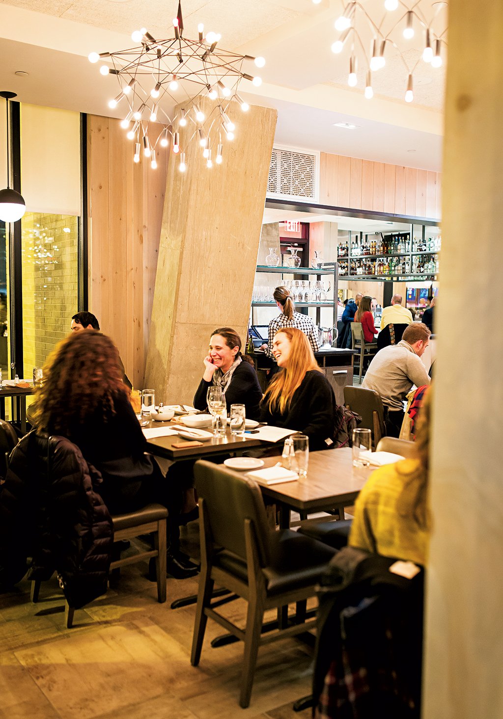 At Convivial in Shaw, Washington, DC, diners can share plates of scallop boudin blanc with snow peas and trout roe (opposite left) or pickled rockfish with green papaya and winter radish. Photograph by Scott Suchman.