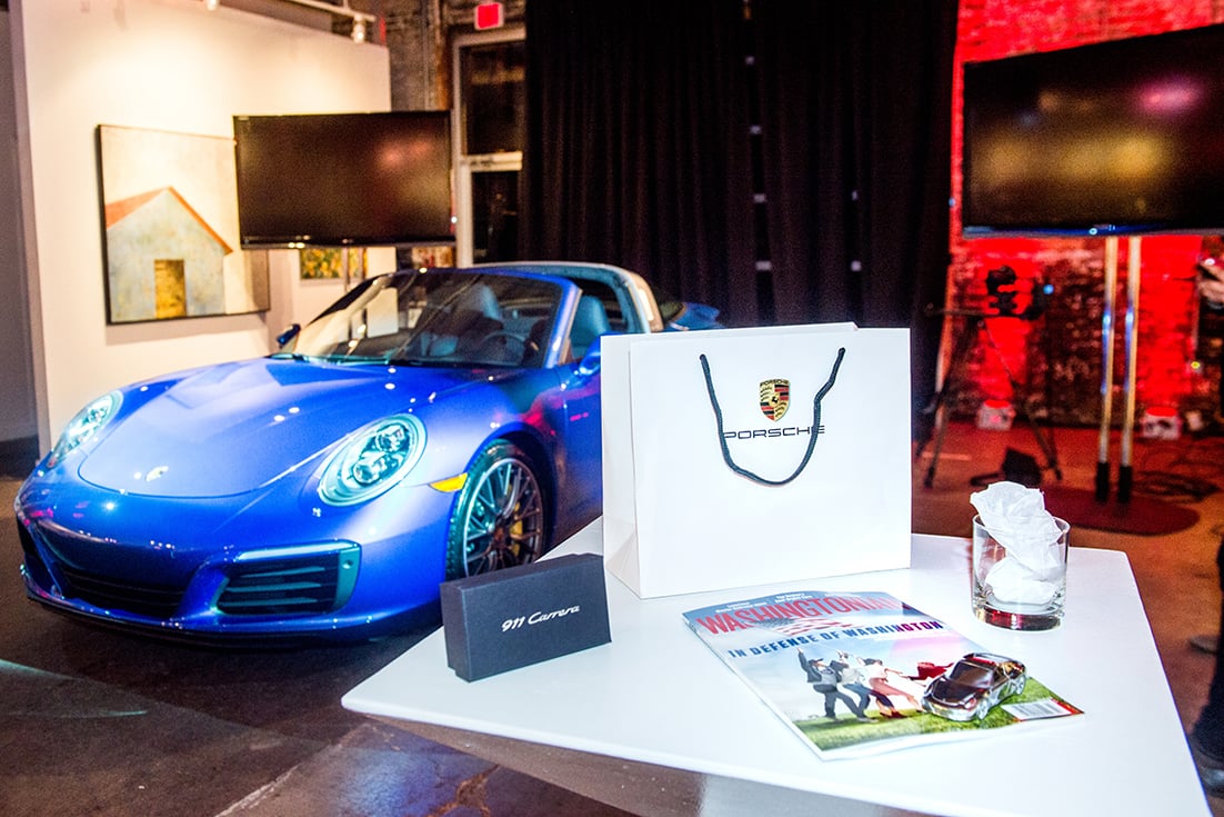 Attendees enjoyed the Porsche 911 reveal and took home a gift bag with a Porsche paper weight, whiskey glass, and a copy of the Washingtonian. 