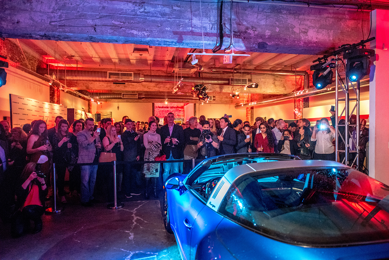 Guests gathered to take photos and admire the new Porsche 911 Targa 4s. 