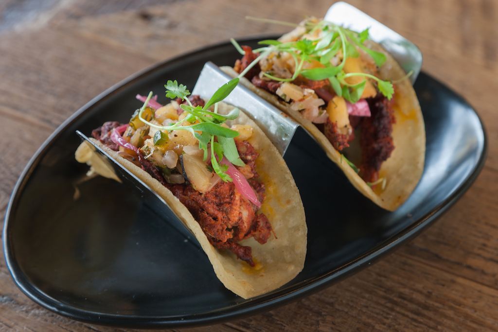 Palette 22 offers eclectic brunch fare, like Cuban sliders and these jerk chicken tacos. Photograph 