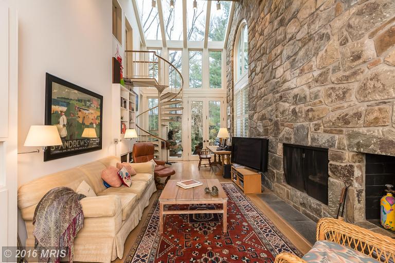 Dramatic stone and glass family room -