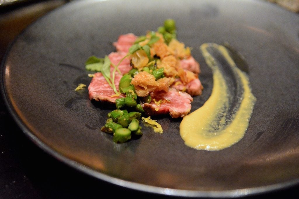 Beef tataki with asparagus and crispy chicken skin.