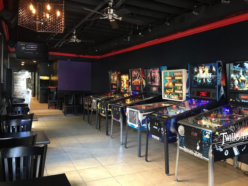 Get your pinball and pizza fix at Vuk, which specializes in New York-style pies. Photograph via Facebook