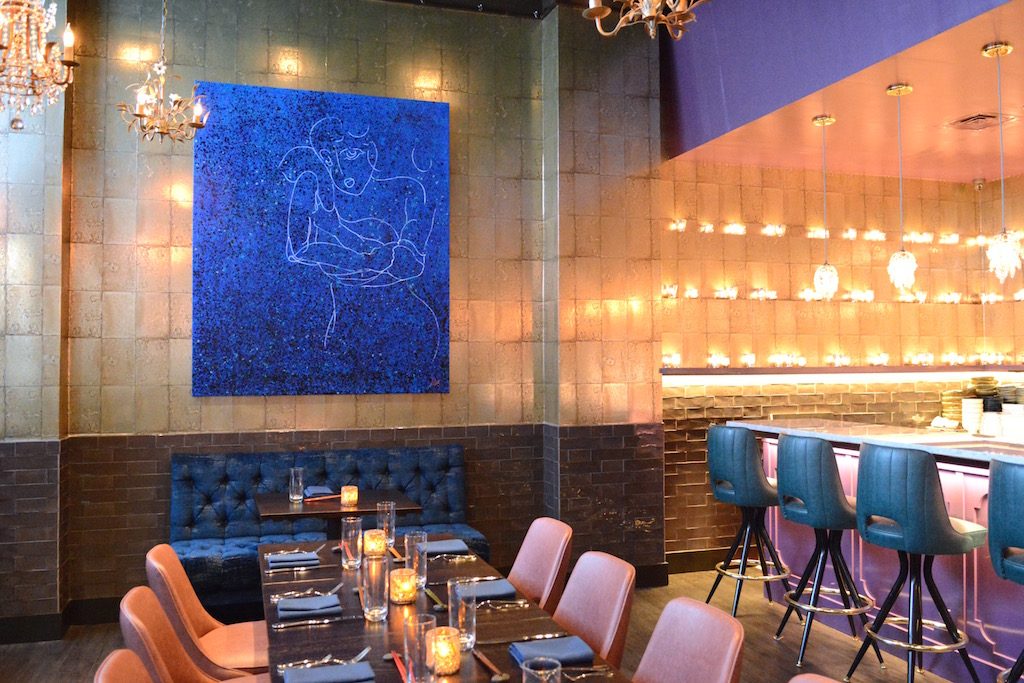 Restaurateur Michael Schlow's crudo bar flickers with candles. Photograph by Laura Hayes