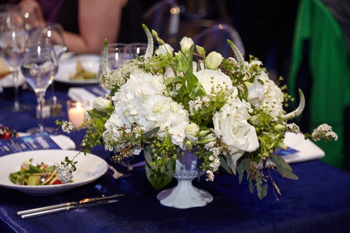 Nature of Design created beautiful floral arrangements for the tables. 