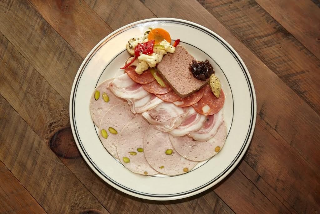 House-made charcuterie plays a large roll, such as mortadella, coppa di testa, and Calabrian-chili spiked pepperoni.