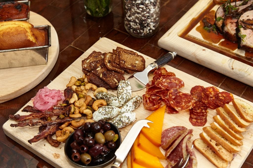 Local cheese and meat boards are designed for group sharing. 