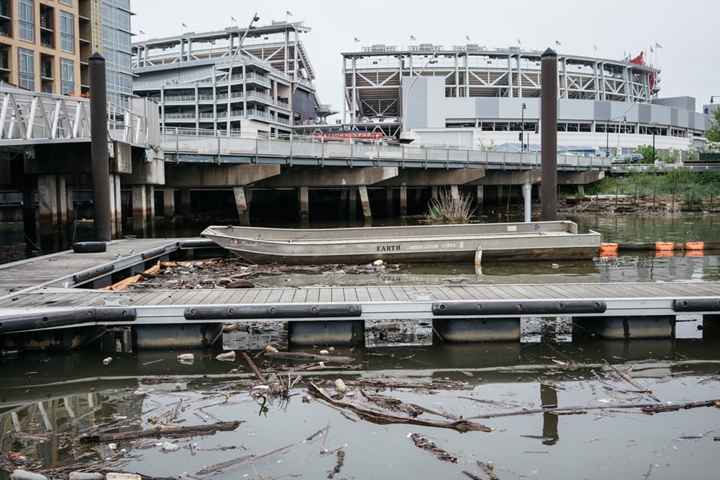 Litter collects at the Earth Conservation Corps building on the Anacostia Waterfront next to the Washington Nationals Baseball Stadiumm in Southeast DC. Photograph by Greg Kahn.